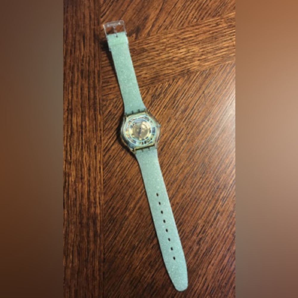 Swatch skin with green glitter silicone band.